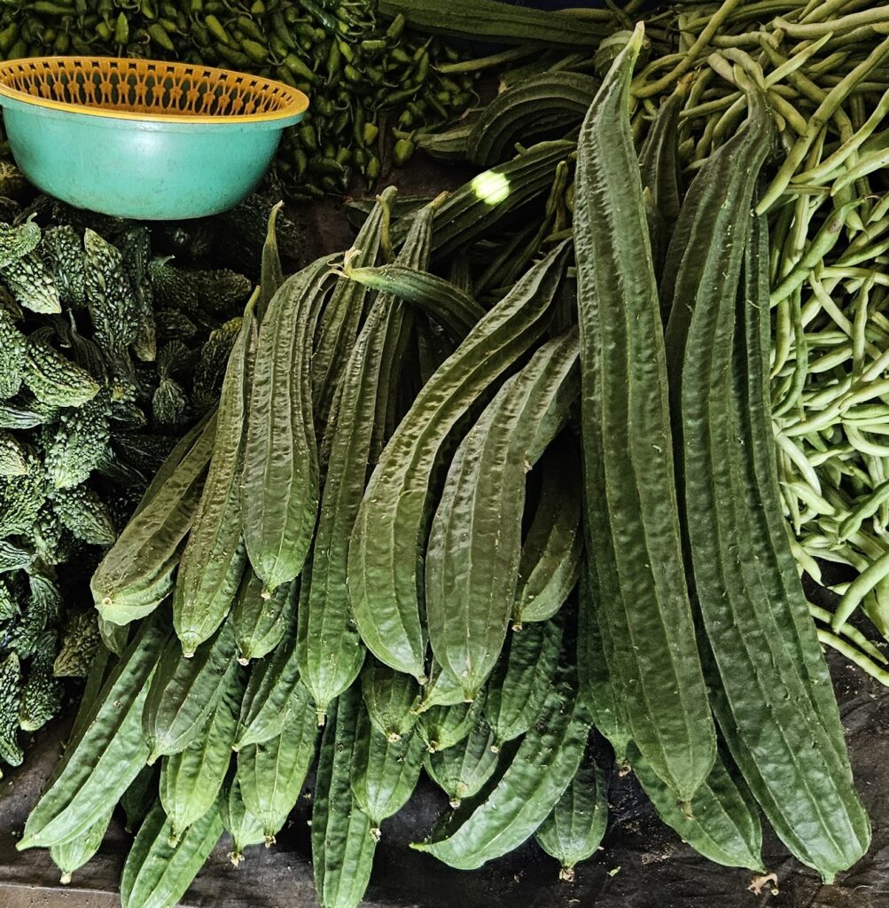 Fresh ridge gourds (Luffa acutangula), long ribbed cucumbers sold at a Sri Lankan market